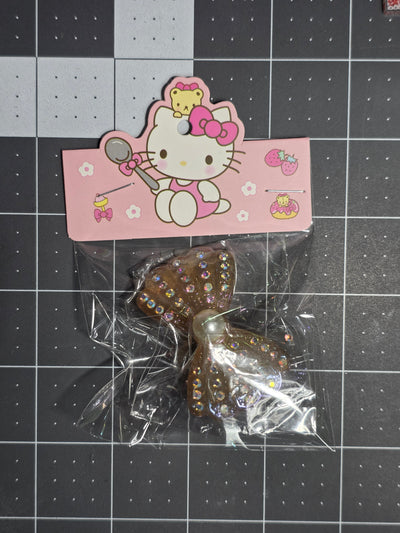 Rhinestone and Pearl Bow Resin Pendant