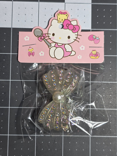 Rhinestone and Pearl Bow Resin Pendant